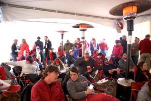 Members and guests of Tusk to Tail seek to stay warm and dry in their Victory Village tent prior to the matchup with Mizzou.
